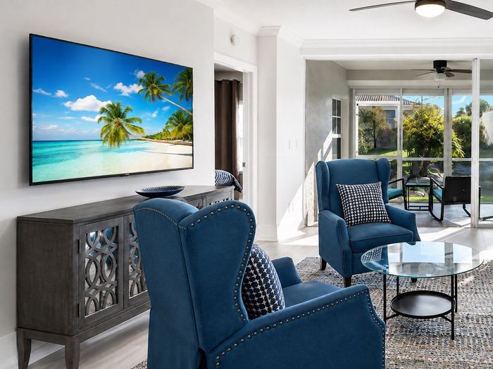 TV and console in a bright Naples living room