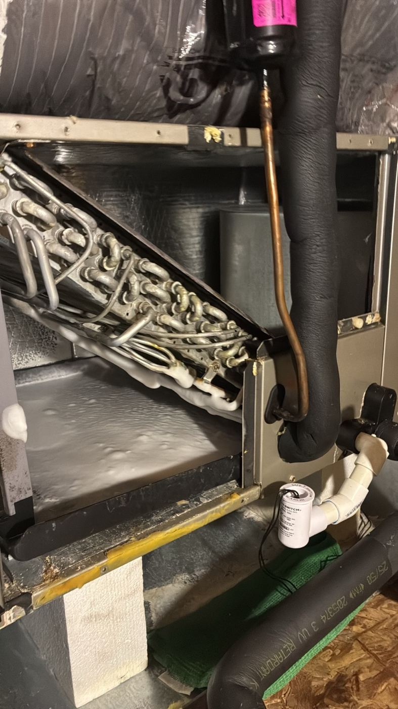 Indoor air handler inspected during AC maintenance
