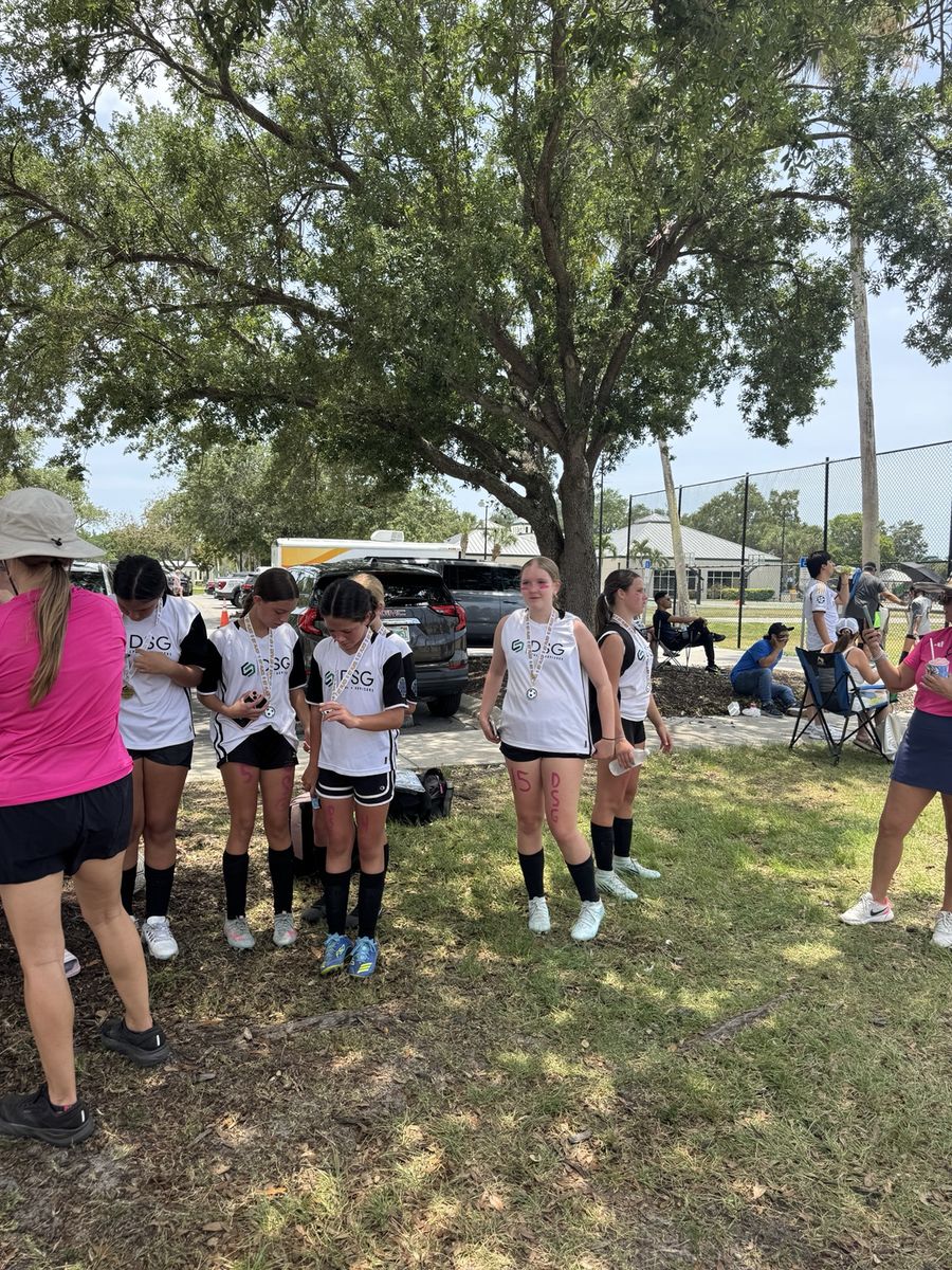 Youth soccer team celebrating after a tournament in Naples